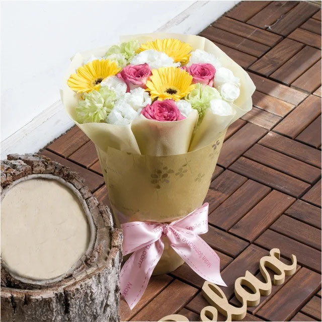Medium size gerbera flower bouquet with brown wrapper