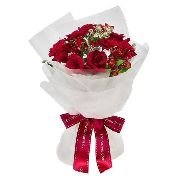Love Confession bouquet of red roses with white filler flowers, wrapped in white paper and tied with a red ribbon
