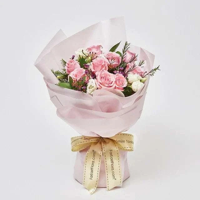 Everlasting Fairytale bouquet with pink roses, white flowers, greenery and delicate translucent wrapping