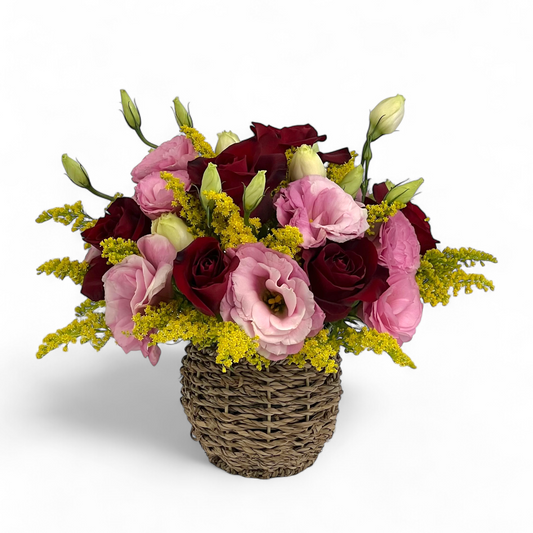 Close-up of Rosy Romance flower arrangement featuring red roses and pink eustoma in a small basket, ideal as a romantic flower gift.
