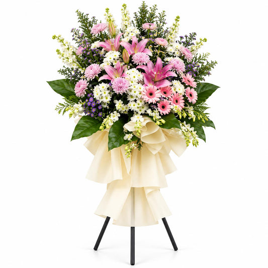 Blooming Memories condolence flower stand with pink lilies, light pink chrysanthemums, white orchids, white matthiola and pink gerberas